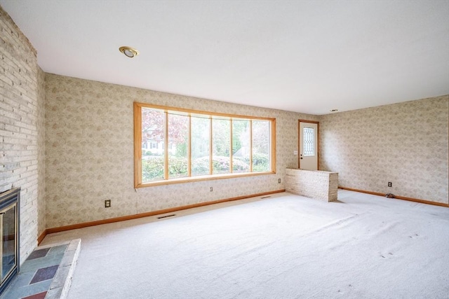 136 Butternut Hollow Rd, West Springfield, MA 01089 - unfurnished living room featuring carpet floors, a brick fireplace, and baseboards