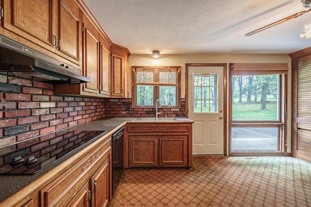 136 Butternut Hollow Rd, West Springfield, MA 01089 - kitchen featuring a sink, black appliances, under cabinet range hood, brown cabinets, and tile counters