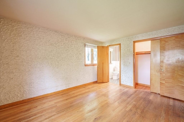 136 Butternut Hollow Rd, West Springfield, MA 01089 - unfurnished bedroom featuring wood finished floors, a closet, ensuite bathroom, and baseboards