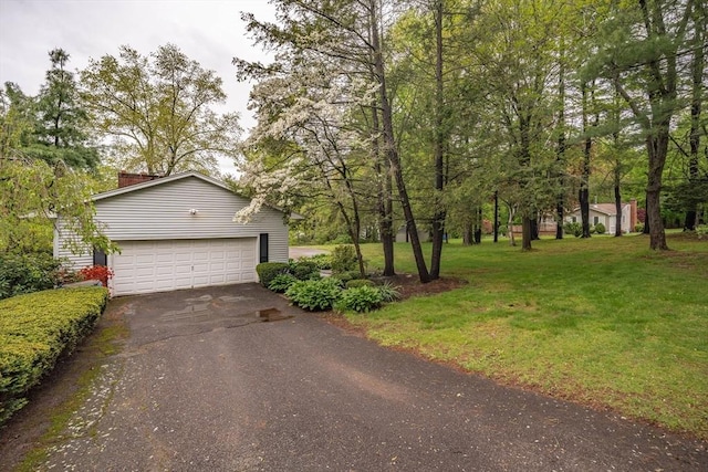 136 Butternut Hollow Rd, West Springfield, MA 01089 - view of front of home with asphalt driveway, a front yard, and a chimney