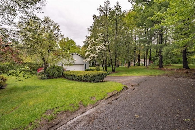 136 Butternut Hollow Rd, West Springfield, MA 01089 - view of front of property with a front yard, an attached garage, and asphalt driveway
