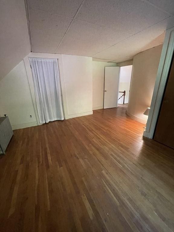spare room with wood finished floors