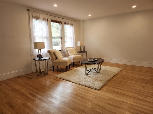 52 Walnut St, Shrewsbury, MA 01545 - living area with wood finished floors, baseboards, and recessed lighting
