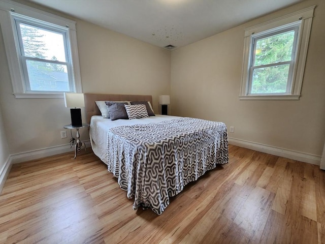 52 Walnut St, Shrewsbury, MA 01545 - bedroom featuring light wood-style flooring and baseboards