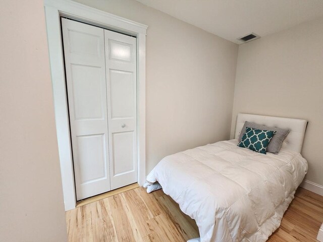 52 Walnut St, Shrewsbury, MA 01545 - bedroom with light wood-style flooring and a closet