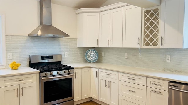 52 Walnut St, Shrewsbury, MA 01545 - kitchen with appliances with stainless steel finishes, wall chimney exhaust hood, light countertops, white cabinetry, and backsplash