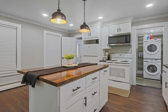 kitchen featuring stacked washer / dryer, white appliances, decorative light fixtures, crown molding, and white cabinetry