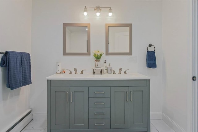 bathroom with baseboard heating and vanity