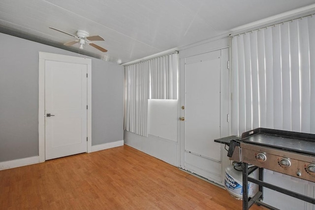 bedroom featuring ceiling fan and light hardwood / wood-style flooring