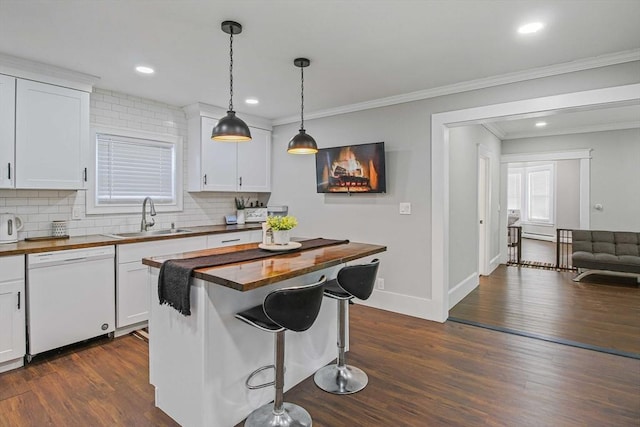 kitchen featuring white cabinetry, dishwasher, and wooden counters