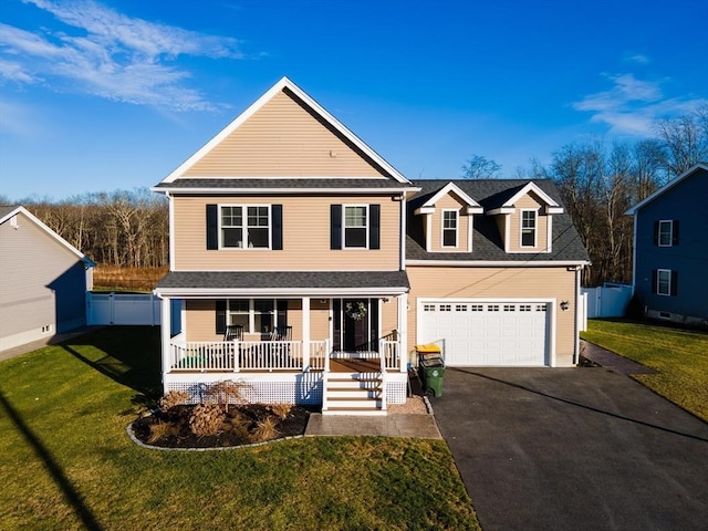 view of property with a porch, a garage, and a front yard