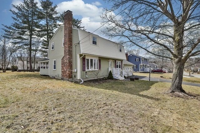 view of front of property with a front lawn and a chimney