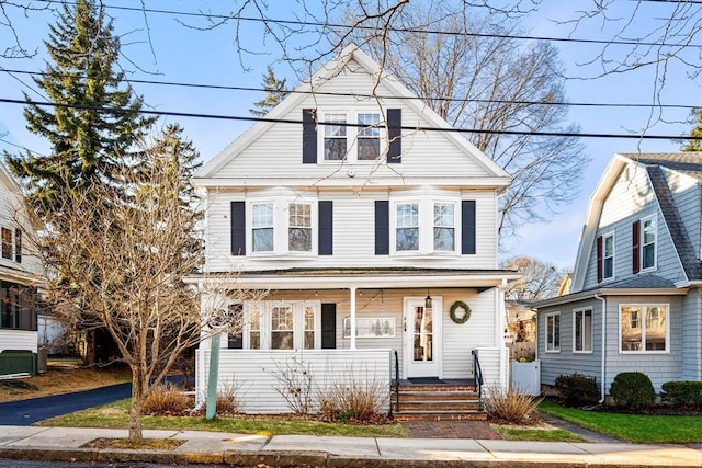 view of property with a porch