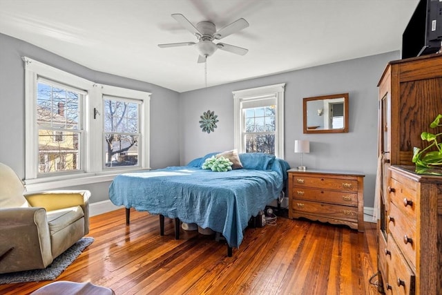 bedroom with hardwood / wood-style flooring and ceiling fan