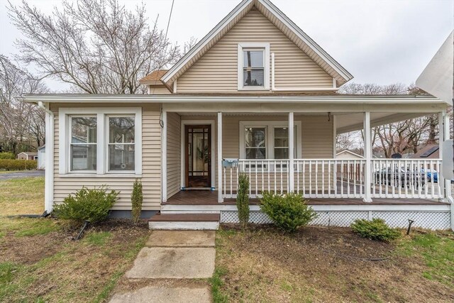 farmhouse inspired home with a porch