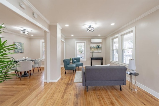 106 Stony Hill Rd, Wilbraham, MA 01095 - living area featuring crown molding, light wood-type flooring, baseboards, and a wall mounted AC