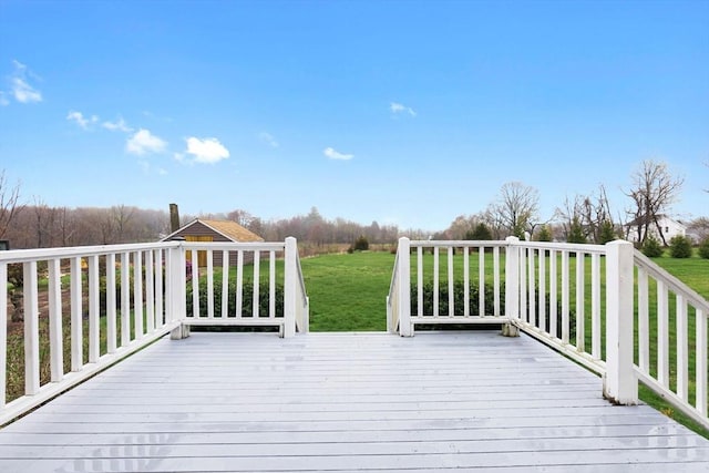wooden deck with a lawn