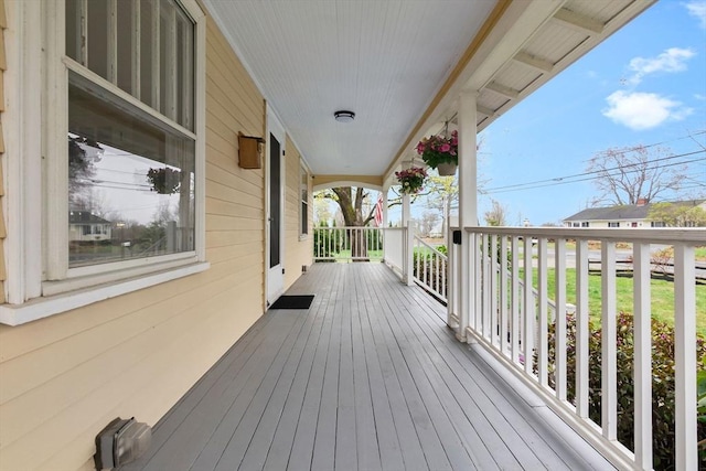 wooden terrace featuring covered porch