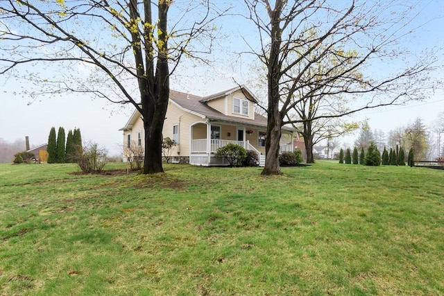 exterior space with a yard and covered porch