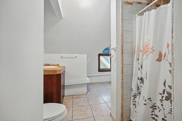 bathroom with tile patterned flooring, vanity, toilet, and a shower with curtain