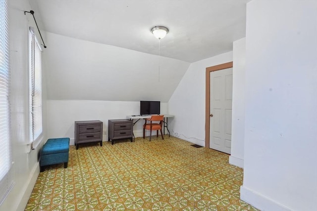 bonus room featuring lofted ceiling