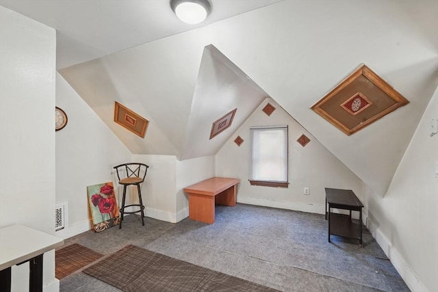 bonus room featuring carpet and lofted ceiling