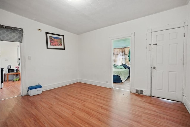 unfurnished room featuring light wood-type flooring