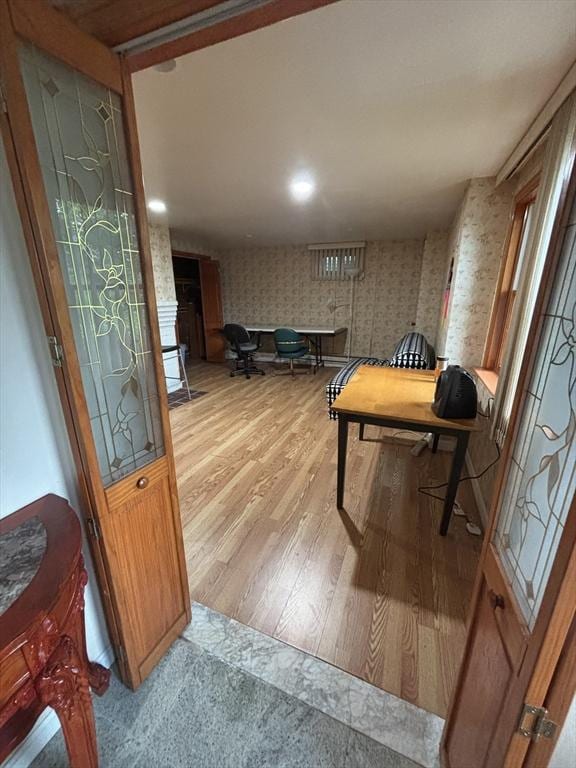 12 Inis Cir, Newton, MA 02465 - rec room with wallpapered walls and wood finished floors