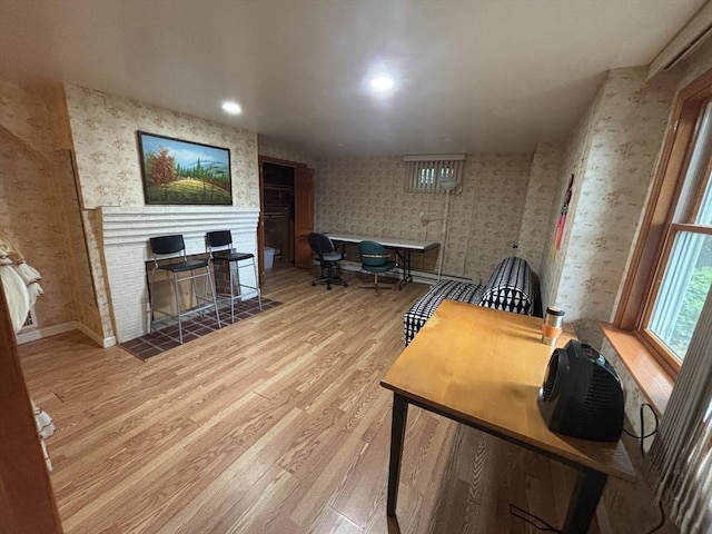 12 Inis Cir, Newton, MA 02465 - office area featuring wallpapered walls, wood finished floors, a tiled fireplace, baseboards, and recessed lighting