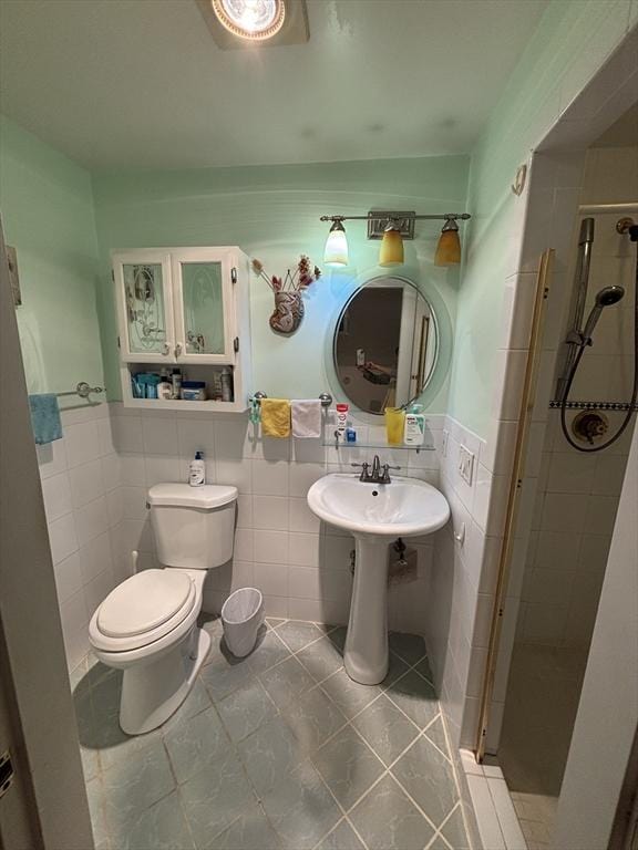 12 Inis Cir, Newton, MA 02465 - full bathroom featuring tile walls, a shower stall, tile patterned flooring, toilet, and a wainscoted wall