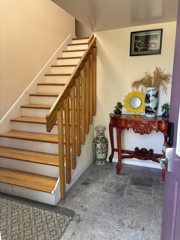 12 Inis Cir, Newton, MA 02465 - stairs featuring baseboards