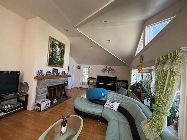 12 Inis Cir, Newton, MA 02465 - living area featuring wood finished floors, a fireplace, recessed lighting, and lofted ceiling