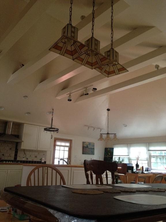 12 Inis Cir, Newton, MA 02465 - dining area with beam ceiling, high vaulted ceiling, and rail lighting