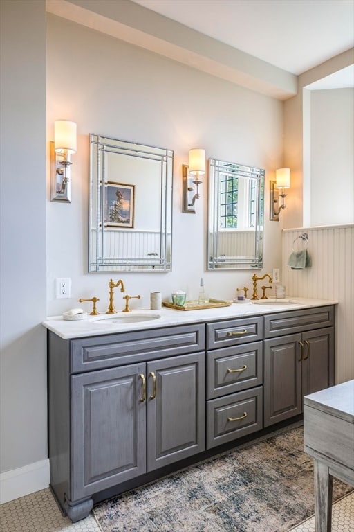 bathroom featuring tile floors and double sink vanity