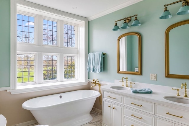 bathroom with a healthy amount of sunlight, a bathing tub, crown molding, and dual vanity