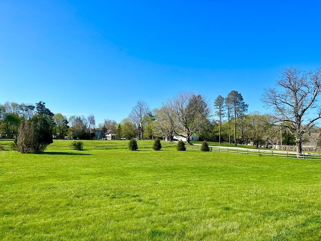 view of nearby features with a yard and a rural view