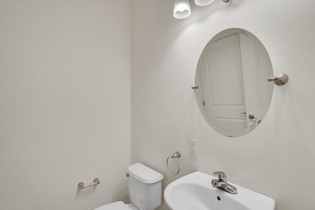 bathroom with sink and toilet