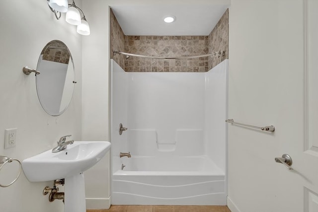 bathroom featuring tile patterned floors and  shower combination