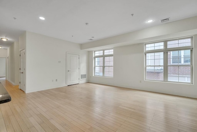 empty room with light wood-type flooring