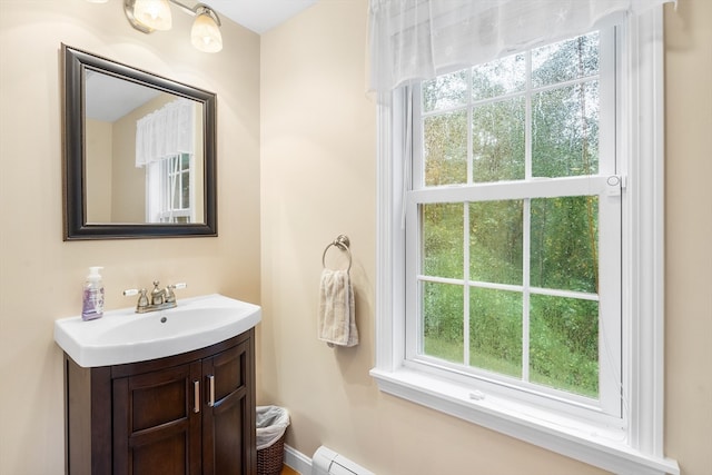 bathroom with plenty of natural light and vanity