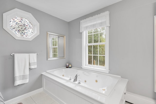 bathroom with tile patterned flooring and a bathing tub