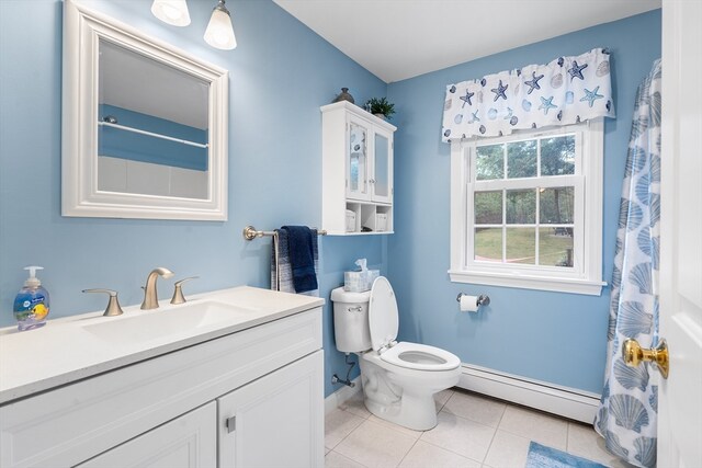 bathroom with vanity, toilet, tile patterned floors, and a baseboard radiator