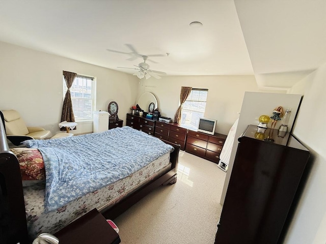 bedroom featuring ceiling fan and light colored carpet