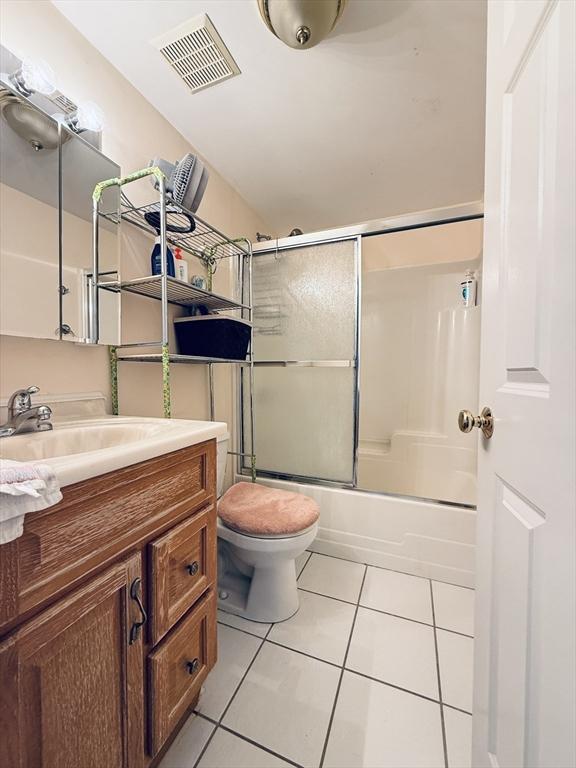 full bath with vanity, tile patterned flooring, toilet, and visible vents