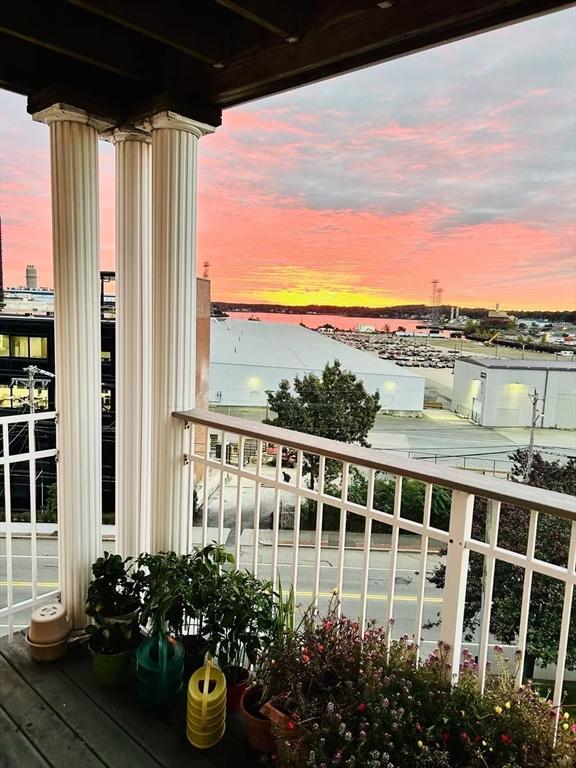view of balcony at dusk