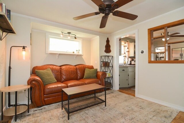 82 Circuit Ave, Weymouth, MA 02188 - living area with ceiling fan, crown molding, baseboards, and wood finished floors