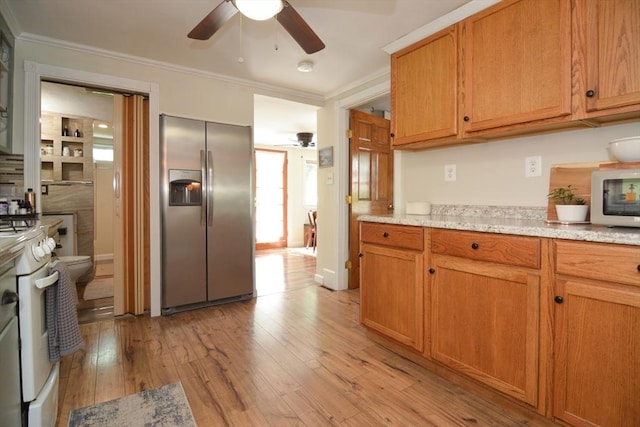 82 Circuit Ave, Weymouth, MA 02188 - kitchen featuring white appliances, ceiling fan, crown molding, light wood finished floors, and brown cabinetry