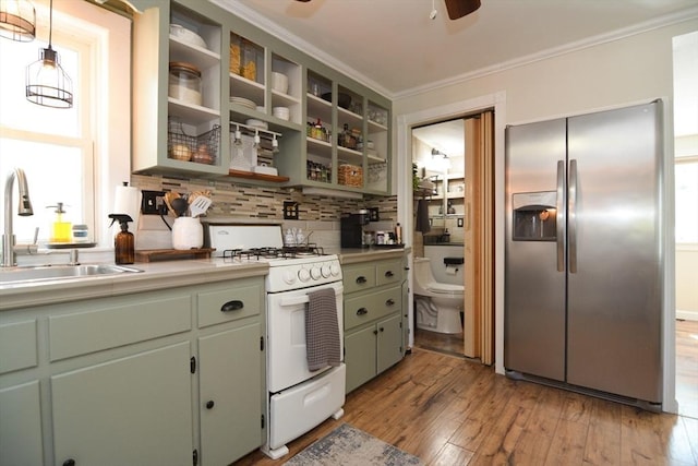 82 Circuit Ave, Weymouth, MA 02188 - kitchen with stainless steel fridge with ice dispenser, white range with gas cooktop, a sink, ceiling fan, and light wood finished floors