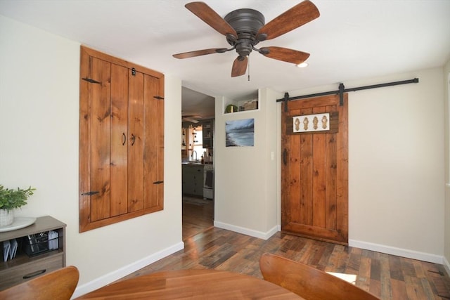 82 Circuit Ave, Weymouth, MA 02188 - foyer entrance featuring a barn door, a ceiling fan, baseboards, and wood finished floors