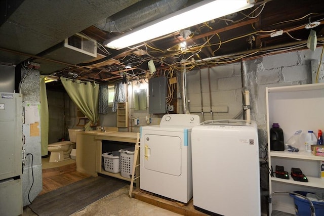 82 Circuit Ave, Weymouth, MA 02188 - laundry room featuring electric panel and washing machine and clothes dryer